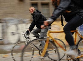Two students riding bicycles