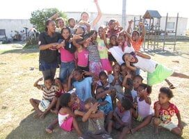 A happy group of children and volunteers in South Africa.