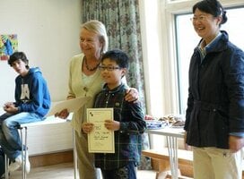 a junior student receives his Oxford International Study Centre certificate . 