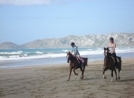 Farmstay girl taking the families daughter for a beach ride