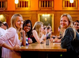 Students chatting and smiling in LMH Dining Hall