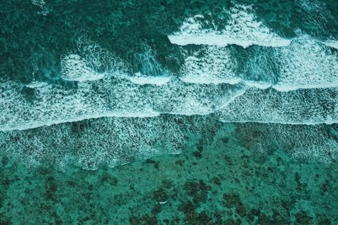An aerial view of the ocean and tides in Belize