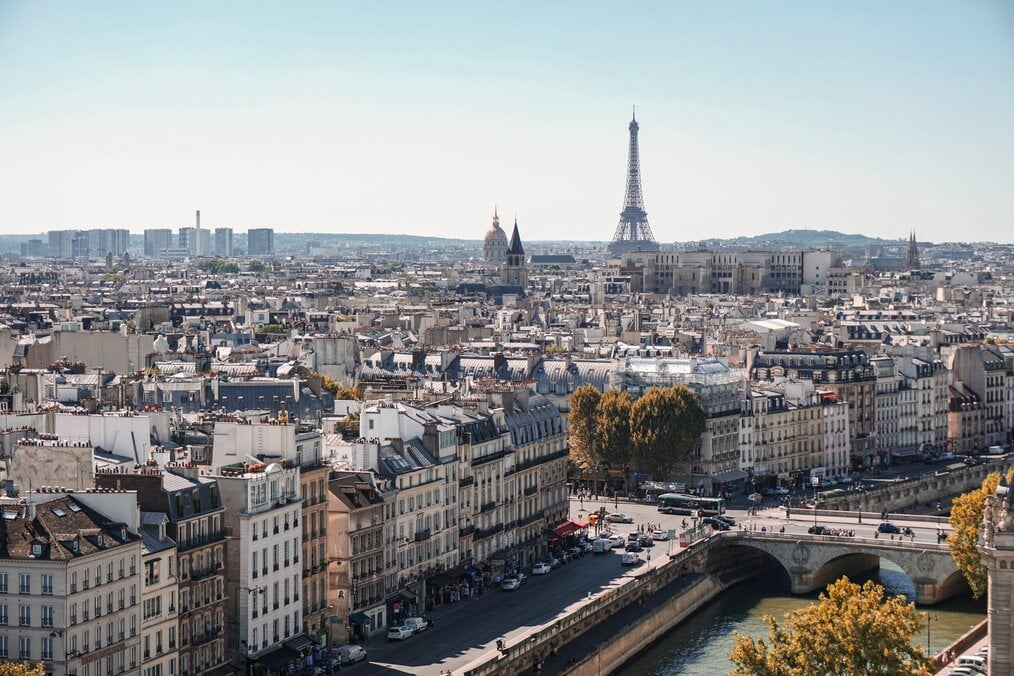 A city view of Paris with the Eiffel Tower in the background.