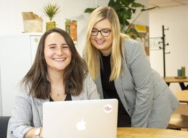 Two interns working at the office