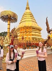 two girls pose in front of a tempe 