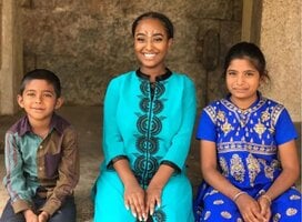 group of school children with study abroad student in India
