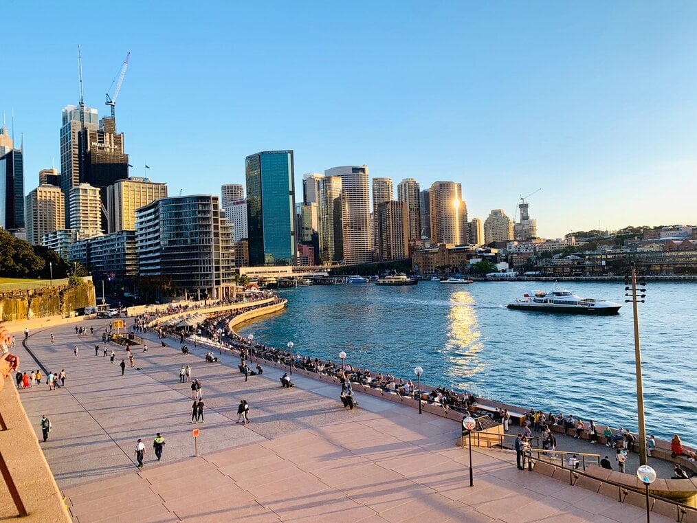 A beach with a city in the background.