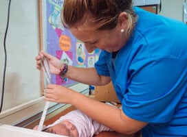 woman nurse working with baby