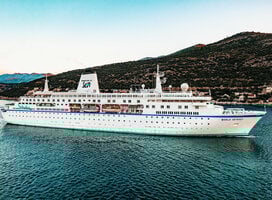 MV World Odyssey sailing into port