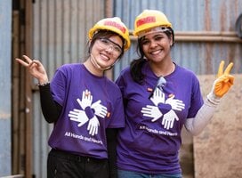 Volunteers wearing purple shirts in Nepal