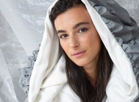 Model displaying hooded garment created by students of Accademia del Lusso