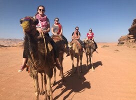 Students exploring the Wadi Rum desert by camel