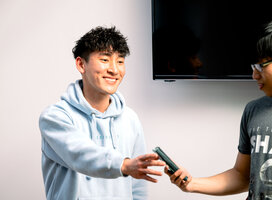 Happy student enjoying communications workshop