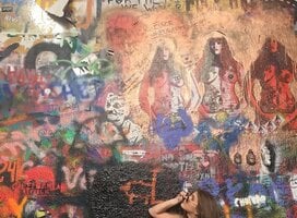 Student looks up at art