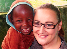Child and Volunteer Smiling 